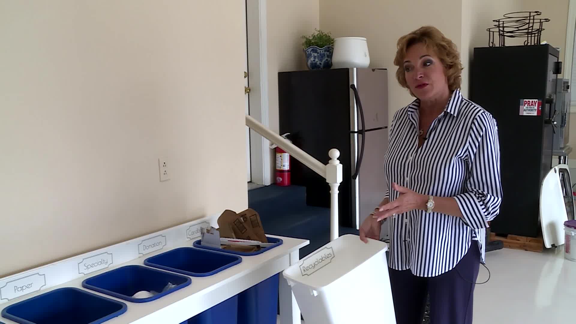 woman explaining how she collects recyclables before taking to convenience center 