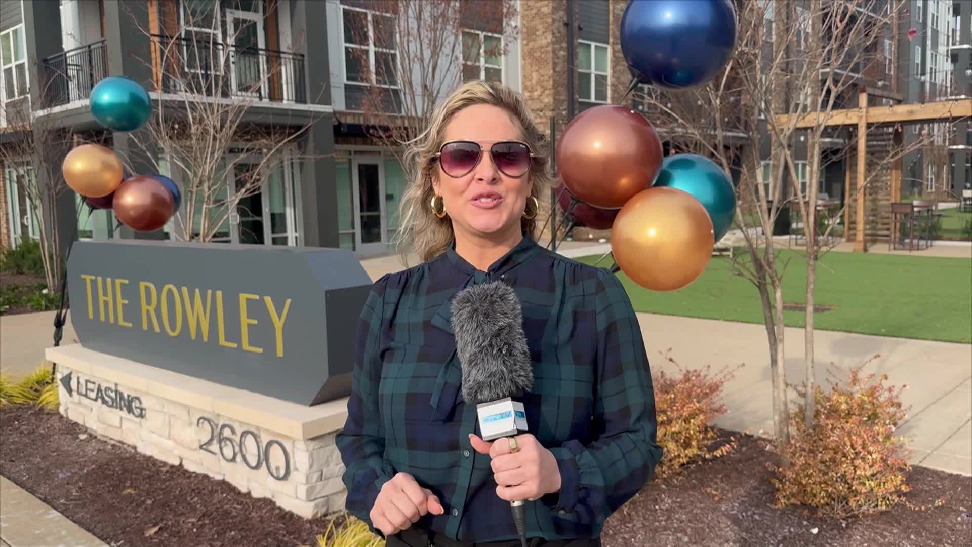 host talking into camera about new apartment complex