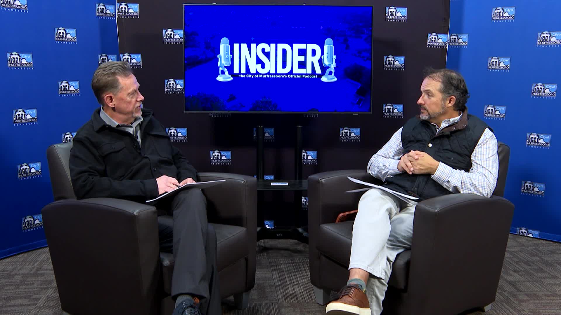 Host and Mayor talking on a podcast about the 2025 year in review