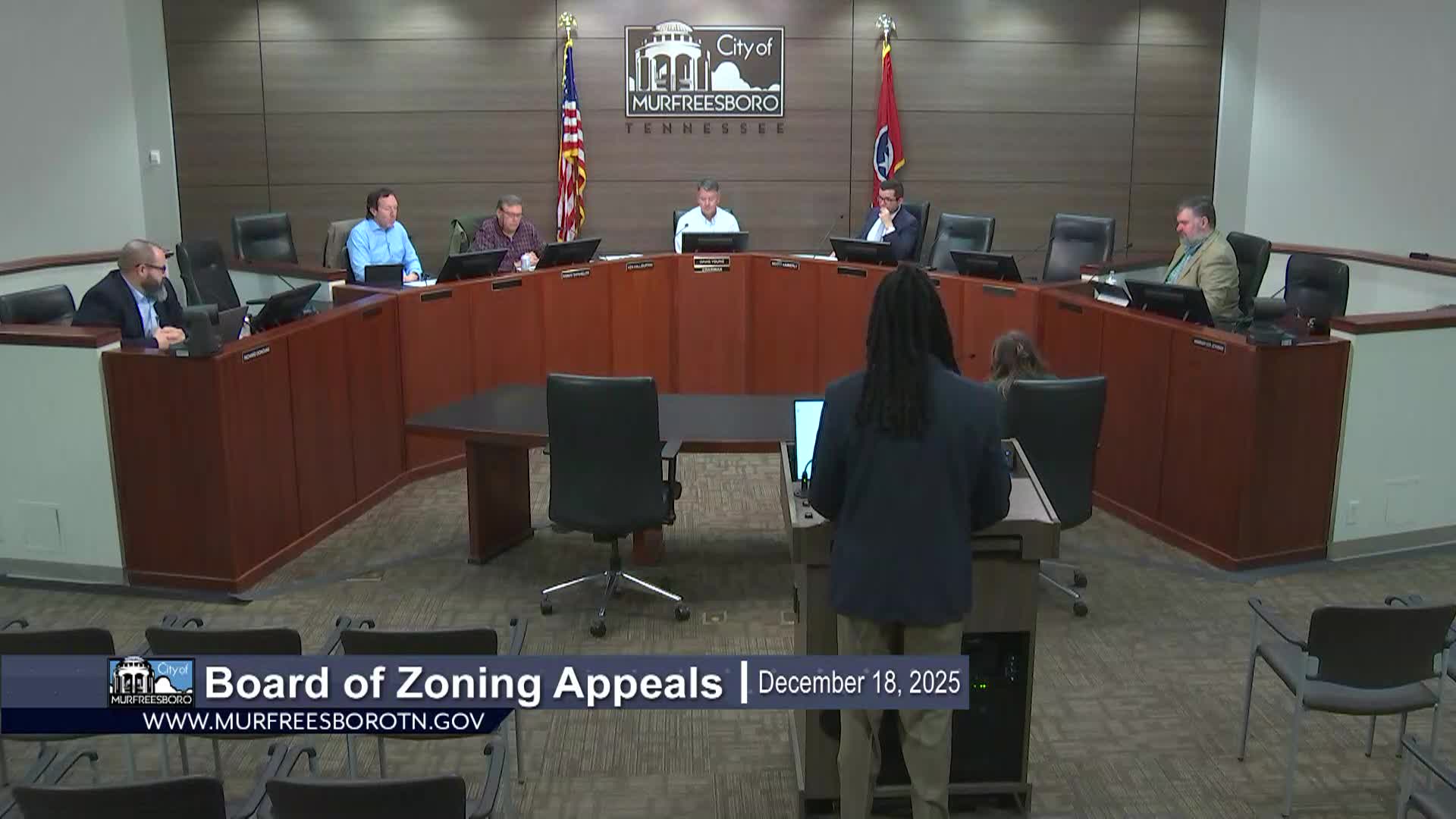 Members of the Board of Zoning Appeals discussing an agenda item