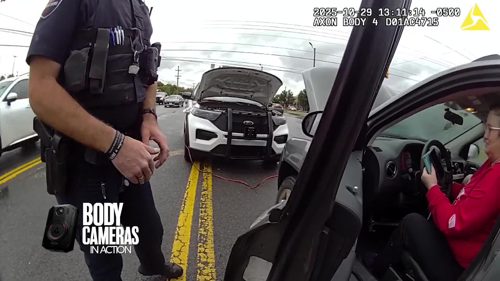 Police officers help stranded motorist