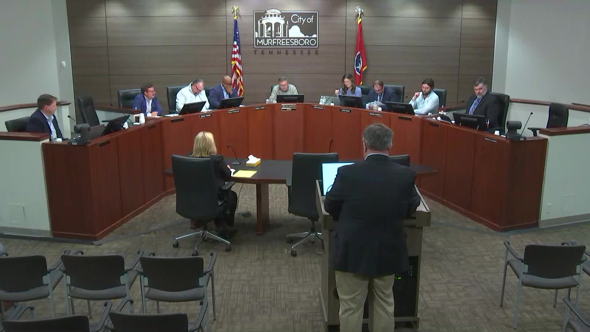 Members of the Planning Commission sitting at dais